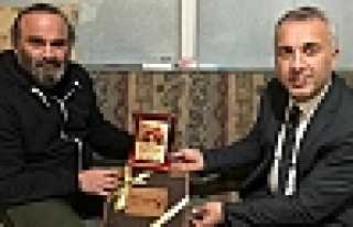 Babaoğlu’ndan Baycan’a Plaket